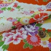 一越ちりめん かのこ雲に百花扇柄（オレンジ）
