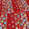 ポリちりめん生地 小さな丸椿(赤) 10cm単位 切り売り