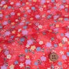 ちりめん生地 ぼかし地に芝と小花(赤)