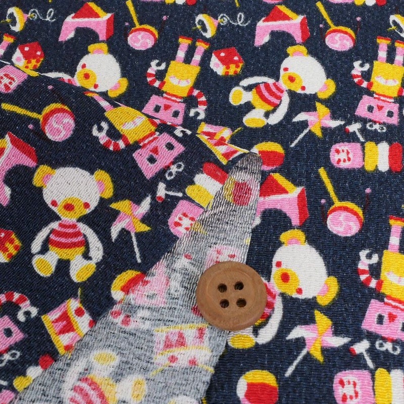 ちりめん生地 おもちゃのパレード(紺) 10cm単位 切り売り