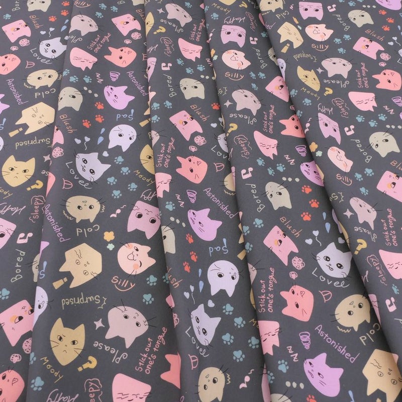 コットン生地 カラフル猫面相(グレー) 10cm単位 切り売り ネコ柄生地グレイ 猫柄木綿生地 ポップなねこ柄布 noraモエラン