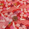 和柄コットン生地 うさぎと桜の吉祥文様(赤) 10cm単位 切り売り