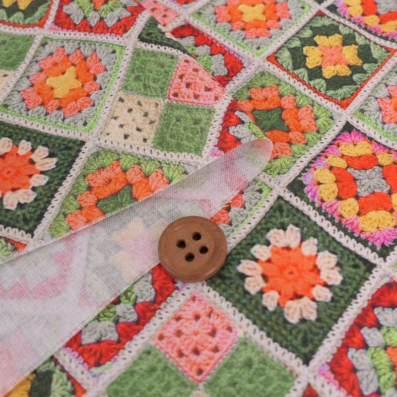 コットン生地 かぎ針編みのモチーフ柄(グリーンオレンジ) 10cm単位 切り売り