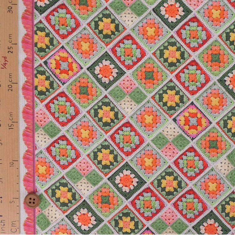 コットン生地 かぎ針編みのモチーフ柄(グリーンオレンジ) 10cm単位 切り売り