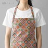 コットン生地 かぎ針編みのモチーフ柄(グリーンオレンジ) 10cm単位 切り売り