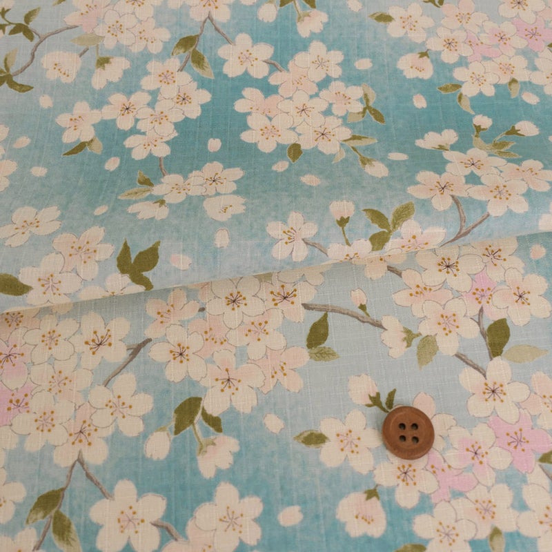 和柄コットン生地 春霞の桜(空色) 10cm単位 切り売り