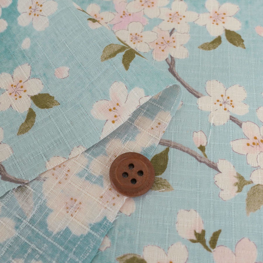 和柄コットン生地 春霞の桜(空色) 10cm単位 切り売り