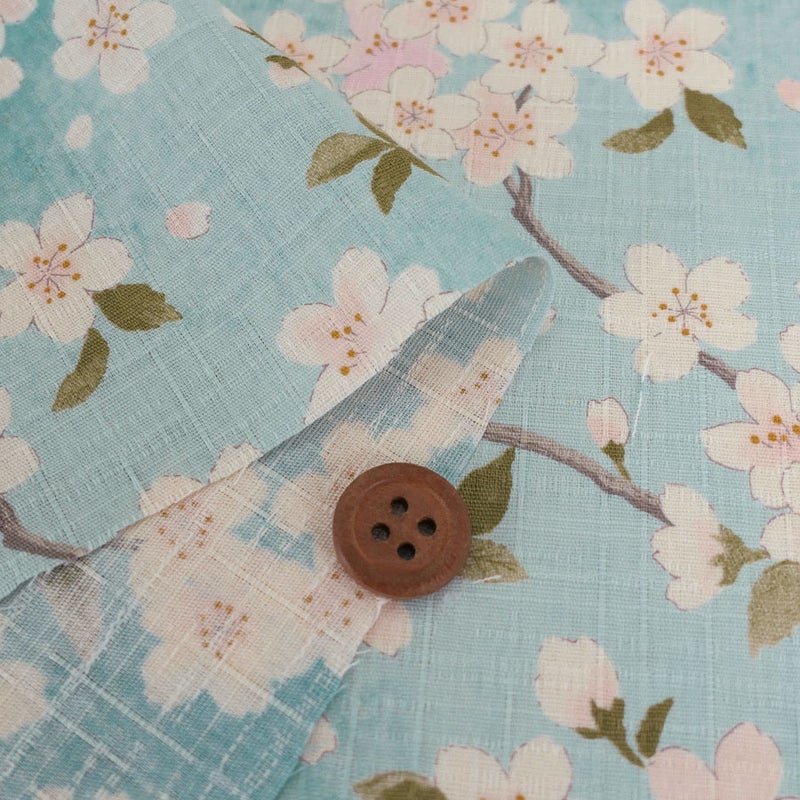 和柄コットン生地 春霞の桜(空色) 10cm単位 切り売り