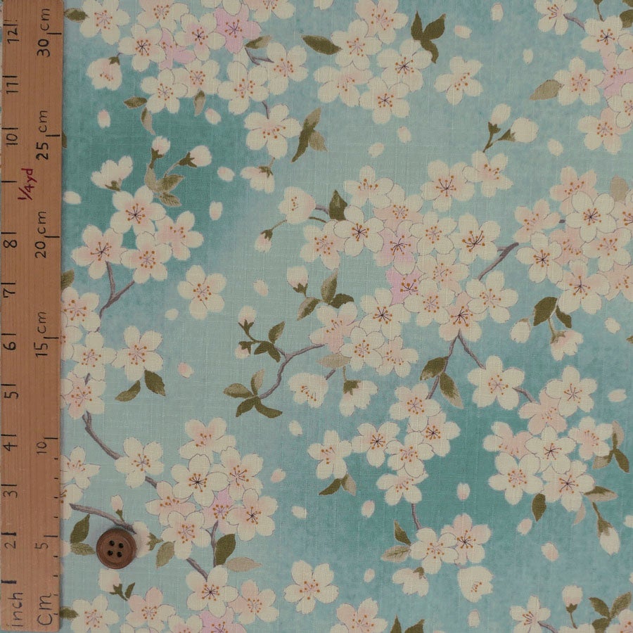 和柄コットン生地 春霞の桜(空色) 10cm単位 切り売り