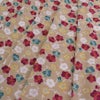 ポリちりめん生地 くるり小梅(ベージュ) 10cm単位 切り売り