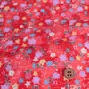 ちりめん生地 ぼかし地に芝と小花(赤) １ｍ単位