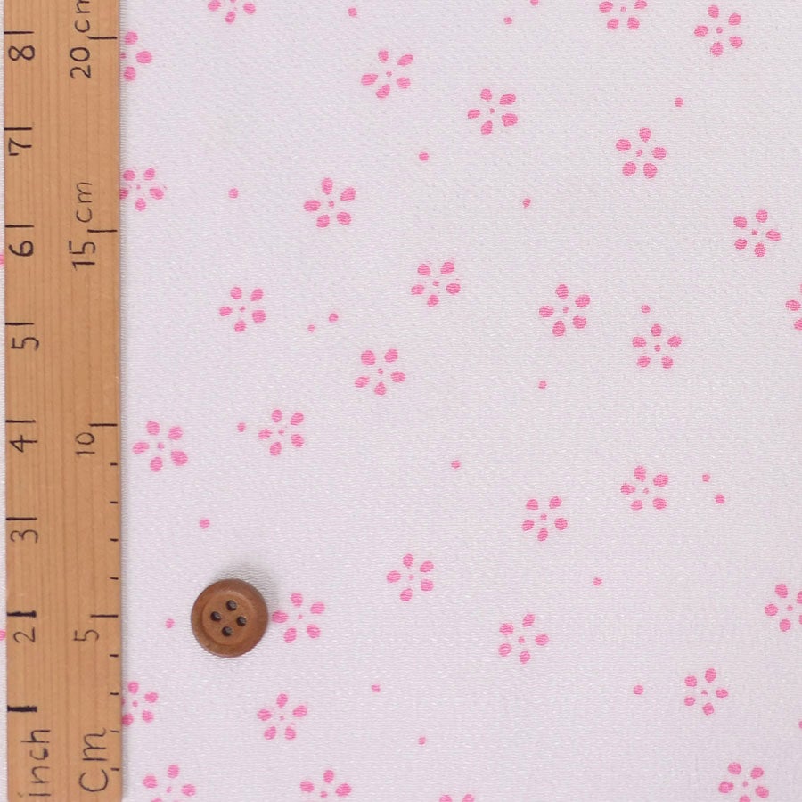 ちりめん生地 つぶらな小花ちらし(白桃) 10cm単位 切り売り