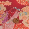 ポリちりめん生地 花雪輪に桜(赤) 10cm単位 切り売り